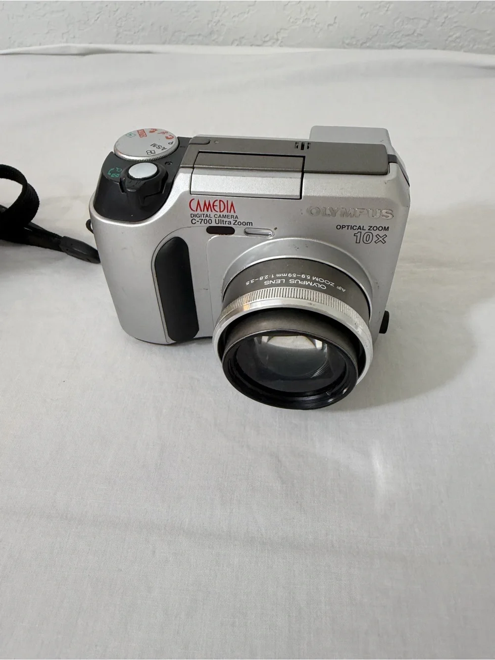 Olympus Silver Compact Digital Camera with Black Wrist Strap